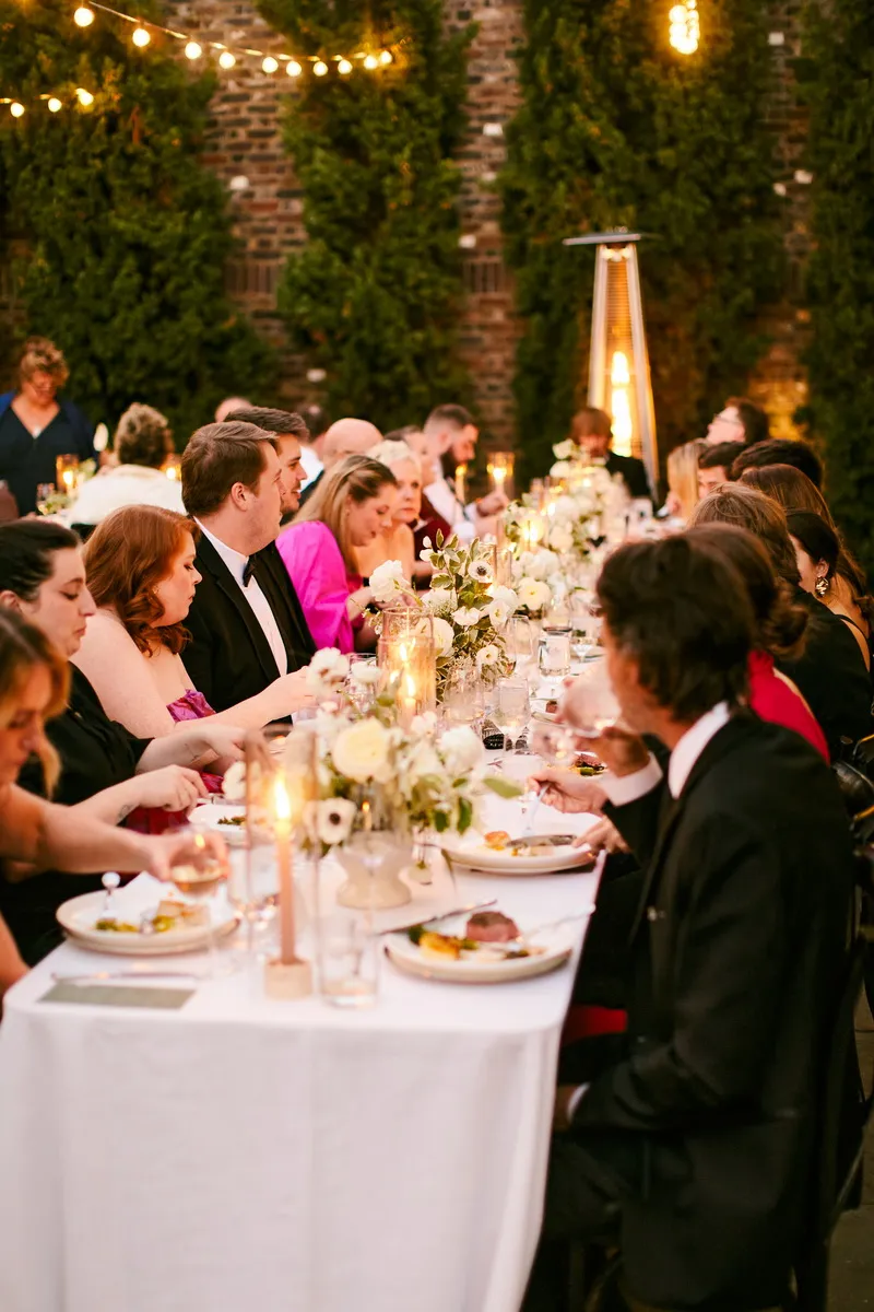 A candlelit reception dinner table at The Dewberry Hotel in Charleston